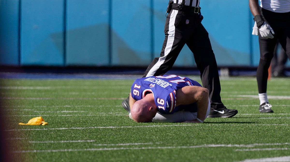 Buffalo Bills punter Cameron Johnston is hunched over in pain after a punt during second half action of the Bills home game against the New Orleans Saints in Orchard Park on Sept. 28, 2025. One of the officials threw a flag for roughing the kicker.