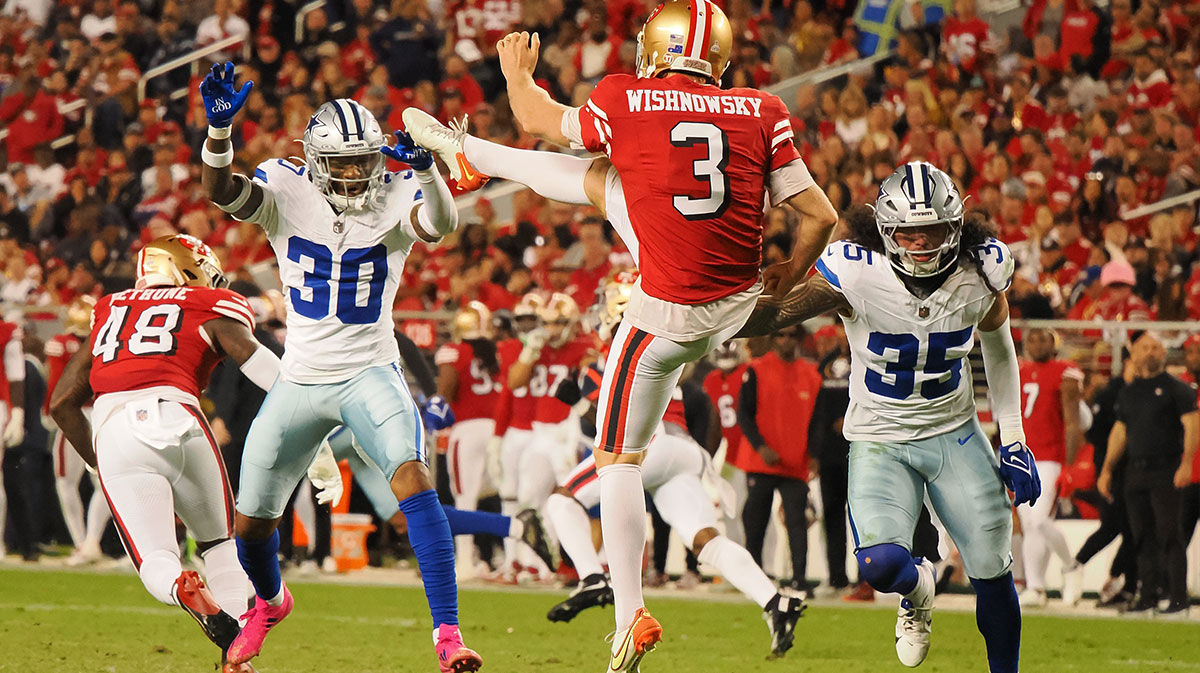 San Francisco 49ers punter Mitch Wishnowsky (3) punts the ball against Dallas Cowboys safety Juanyeh Thomas (30) and linebacker Marist Liufau (35) during the fourth quarter at Levi's Stadium.