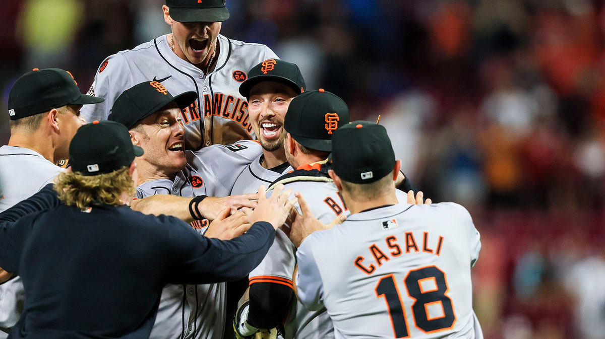 San Francisco Giants teammates congratulate pitcher Blake Snell after he threw a no-hitter against the Cincinnati Reds at Great American Ball Park.