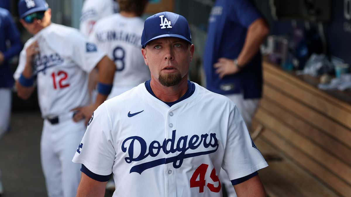 Los Angeles Dodgers relief pitcher Blake Treinen (49) walks in the dugout after being relieved from the game during the eighth inning at Dodger Stadium.
