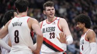 Portland Trail Blazers center Donovan Clingan (23) talks with Blazers forward Deni Avdija (8) during a break in the action against the Toronto Raptors during the first half at Scotiabank Arena.