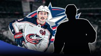 Zach Werenski with a mystery player. Columbus blue jackets logo in the background