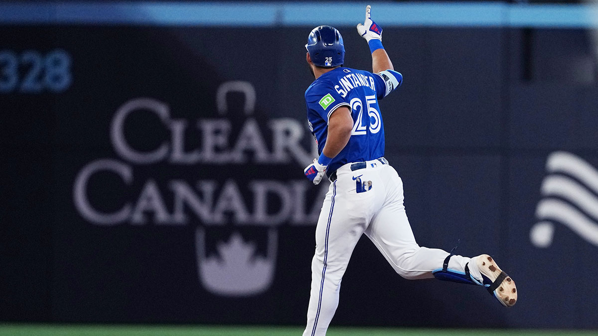 Toronto Blue Jays designated hitter Anthony Santander (25) runs the bases and celebrates hitting a two-run home run against the San Diego Padres during the fifth inning at Rogers Centre.