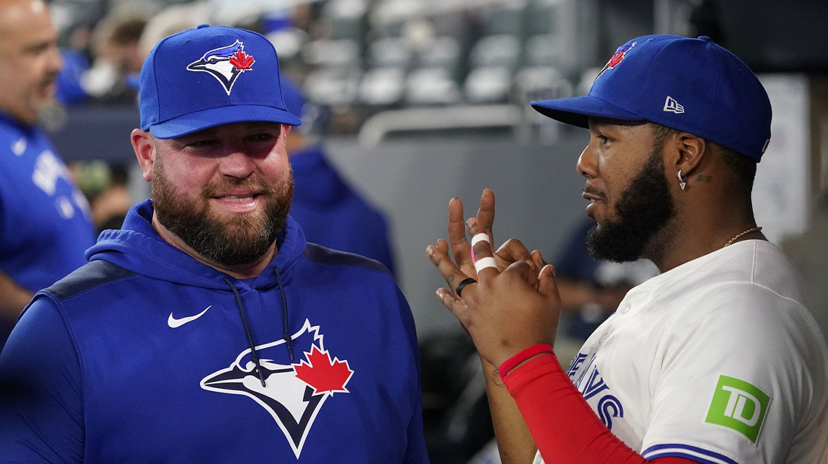 Blue Jays manager John Schneider and first baseman Vladimir Guerrero Jr.