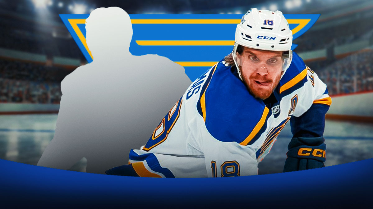 Robert Thomas with a mystery player. Blues Logo in the background.