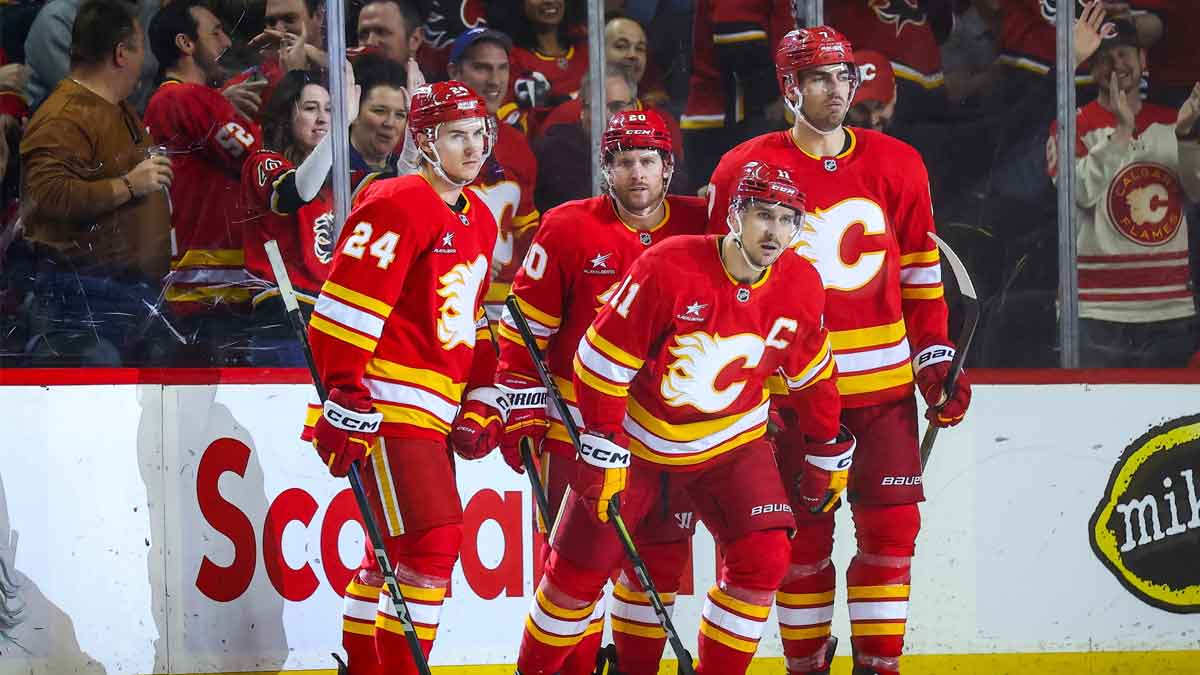 Calgary Flames center Mikael Backlund (11) celebrates his goal with teammates against the Vegas Golden Knights during the third period at Scotiabank Saddledome.