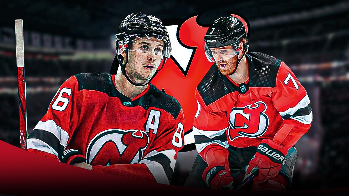 Jack Hughes and Dougie Hamilton with Devils logo in the background.
