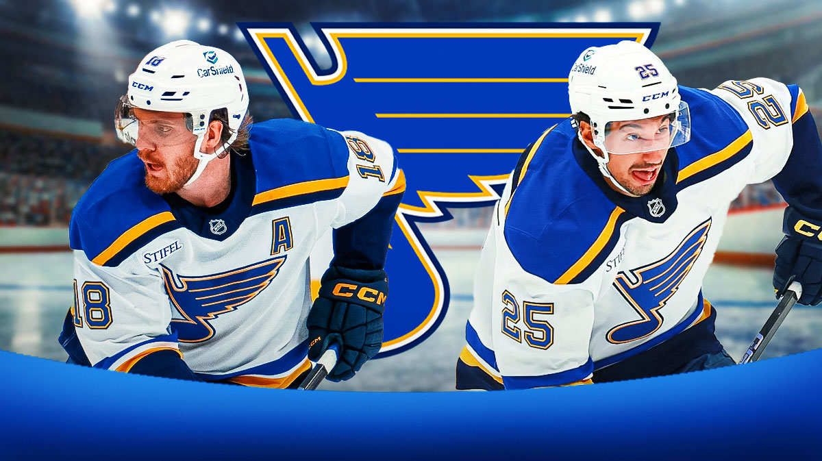Robert Thomas and Jordan Kyrou in front of the St. Louis Blues logo.