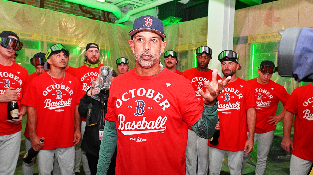 Boston Red Sox manager Alex Cora (13) addresses the team after they clinched a playoff spot after their game against the Detroit Tigers at Fenway Park