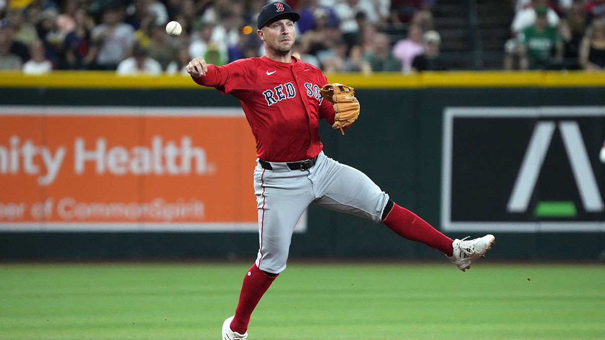 Boston Red Sox third base Alex Bregman (2) mkaes the off balance throw for an out against the Arizona Diamondbacks in the first inning at Chase Field.