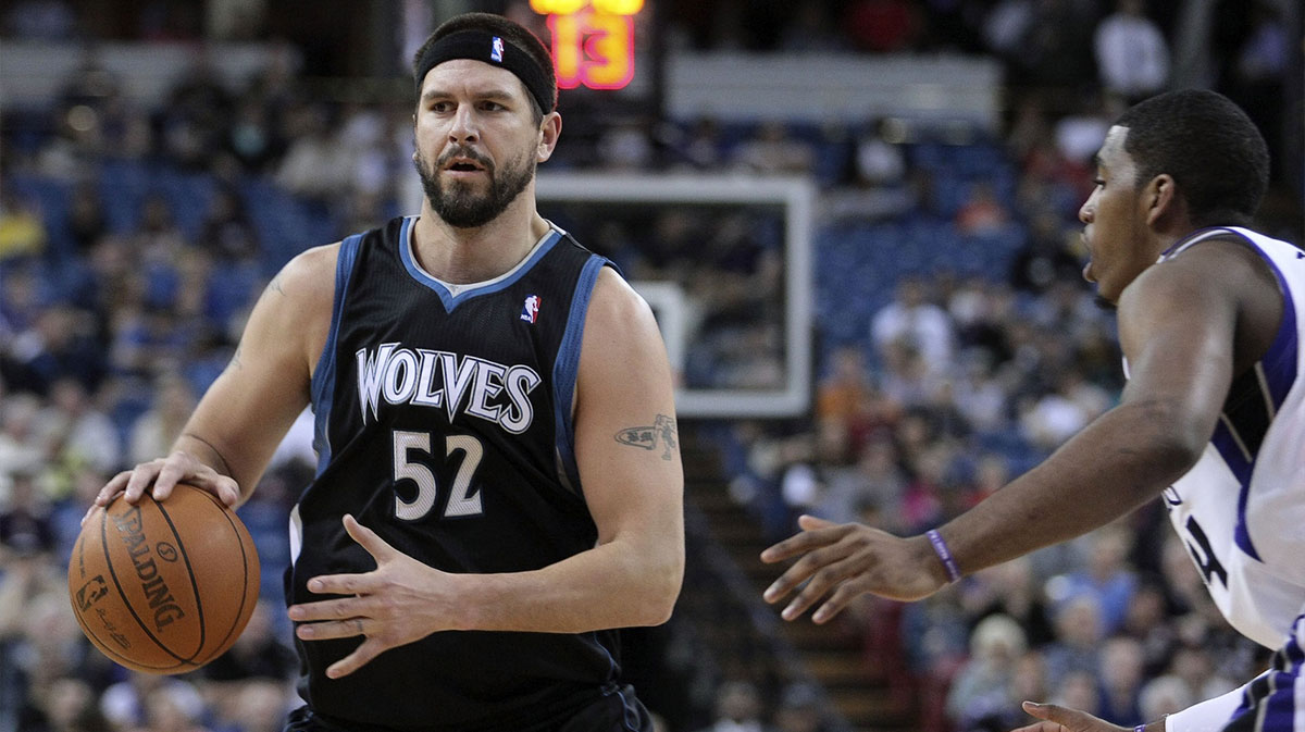 Minnesota Timberwolves center Brad Miller (52) controls the ball against Sacramento Kings center Jason Thompson (34) during the first quarter at Power Balance Pavilion.
