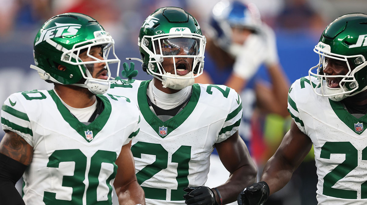 New York Jets cornerback Brandon Stephens (21) celebrates a defensive stop with safety Tony Adams (22) and cornerback Michael Carter II (30) during the first half against the New York Giants at MetLife Stadium.