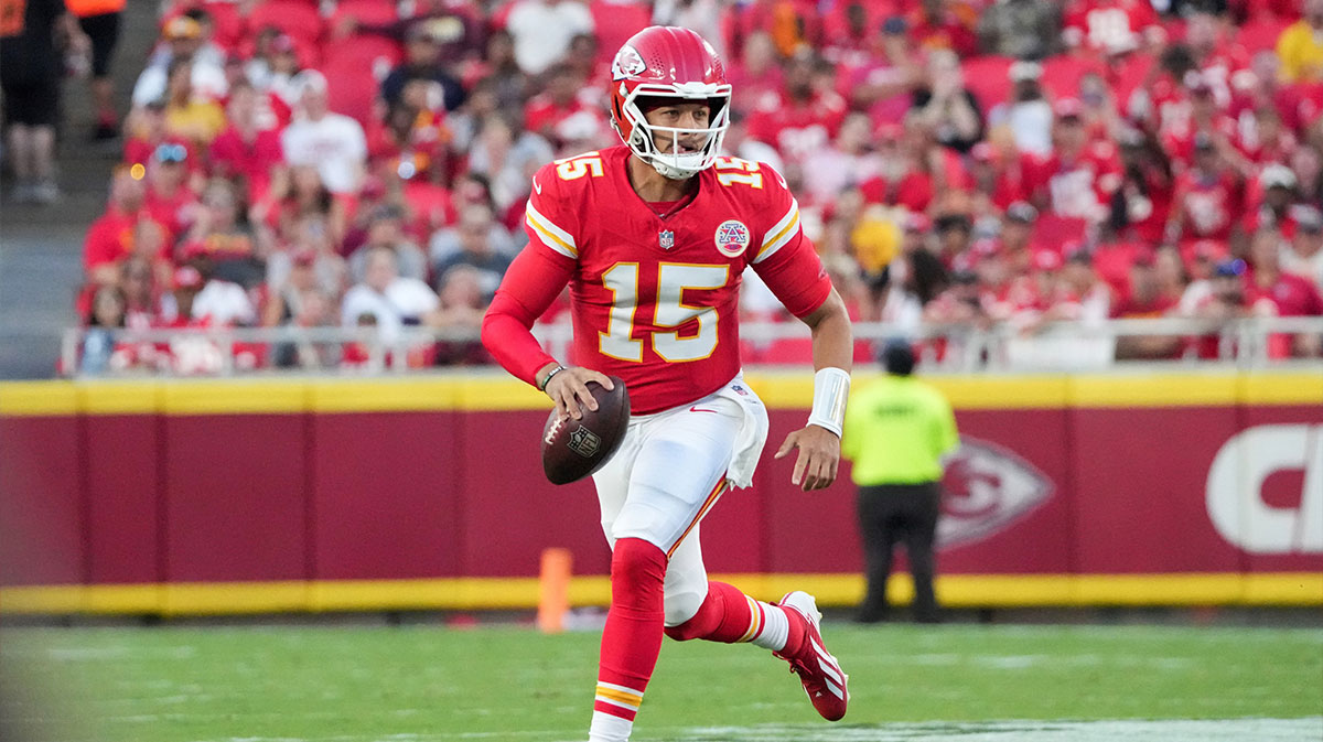 Kansas City Chiefs quarterback Patrick Mahomes (15) scrambles in the backfield against the Chicago Bears during the game at GEHA Field at Arrowhead Stadium.