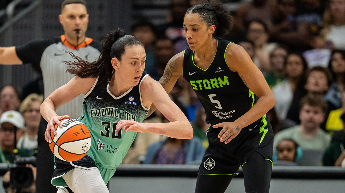 New York Liberty forward Breanna Stewart (30) dribbles the ball against Seattle Storm forward Gabby Williams (5) during the second half at Climate Pledge Arena.