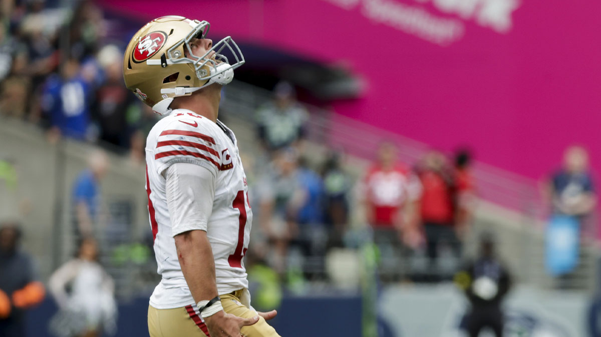 San Francisco 49ers quarterback Brock Purdy (13) celebrates after throwing a touchdown pass against the Seattle Seahawks during the fourth quarter at Lumen Field.
