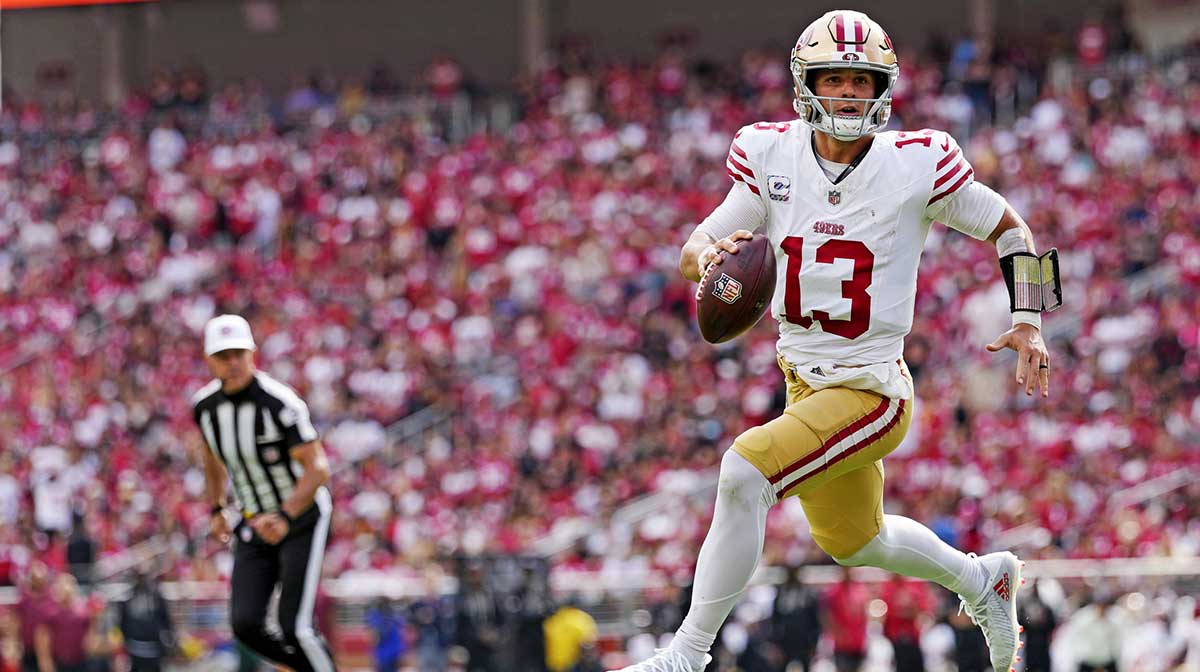 San Francisco 49ers quarterback Brock Purdy (13) runs the ball during the first half against the Jacksonville Jaguars at Levi's Stadium.