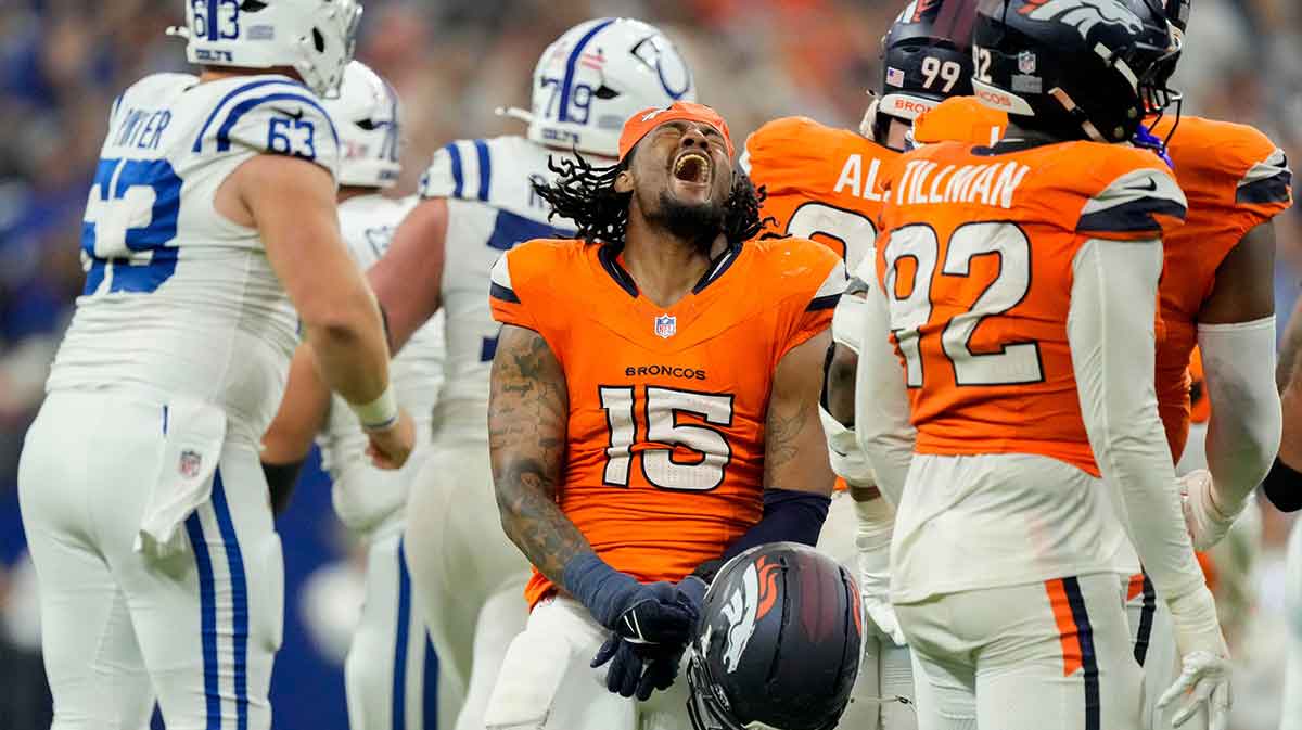 Denver Broncos linebacker Nik Bonitto (15) reacts after a missed field goal by Indianapolis Colts place kicker Spencer Shrader (3) on Sunday, Sept. 14, 2025, during a game at Lucas Oil Stadium in Indianapolis. A penalty on the Broncos game Shrader a second attempt which he made to win the game.