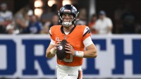 Denver Broncos quarterback Bo Nix (10) runs with the ball during the fourth quarter against the Indianapolis Colts at Lucas Oil Stadium.
