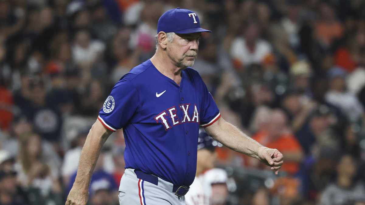 Texas Rangers manager Bruce Bochy (15) walks to the mound for a pitching change during the fifth inning against the Houston Astros at Daikin Park.