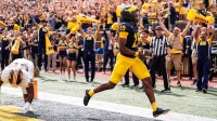 Michigan quarterback Bryce Underwood (19) runs for a touchdown against Central Michigan during the second half at Michigan Stadium