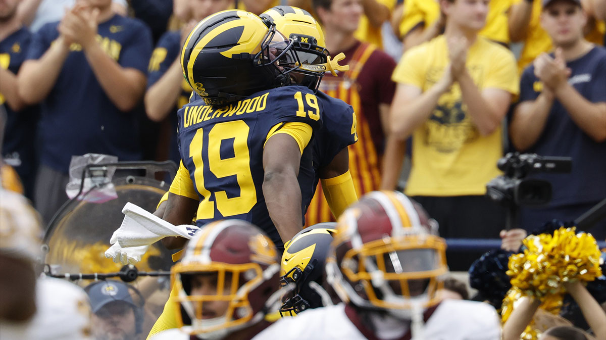Michigan Wolverines quarterback Bryce Underwood (19) and wide receiver Andrew Marsh (4) celebrate a touchdown in the first half against the Central Michigan Chippewas at Michigan Stadium.