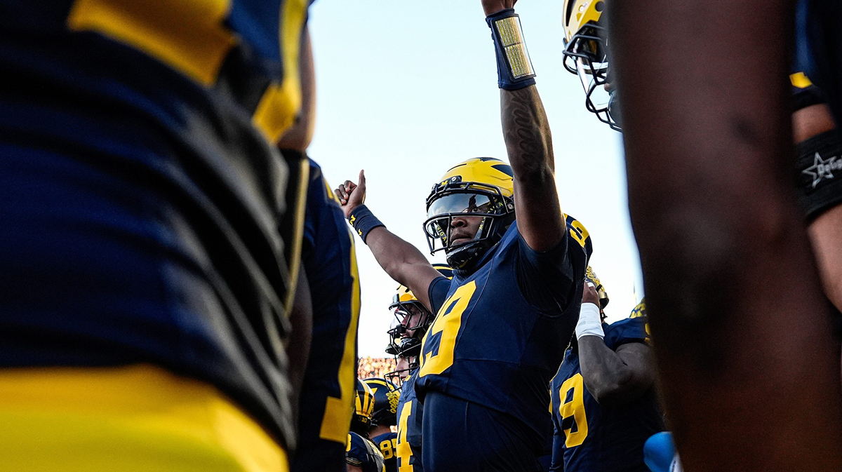 Michigan quarterback Bryce Underwood walks out of the tunnel as the Wolverines prepare to run onto the field for the first half against New Mexico at Michigan Stadium