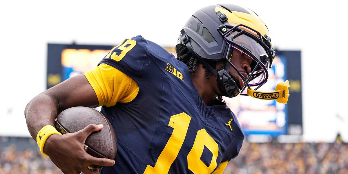 Michigan quarterback Bryce Underwood (19) runs for a first down against Central Michigan during the first half at Michigan Stadium