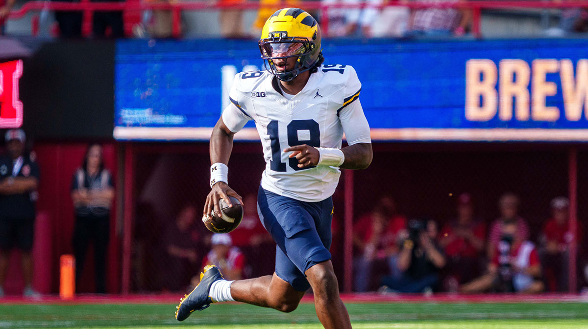 Michigan Wolverines quarterback Bryce Underwood (19) scrambles against the Nebraska Cornhuskers during the third quarter at Memorial Stadium.