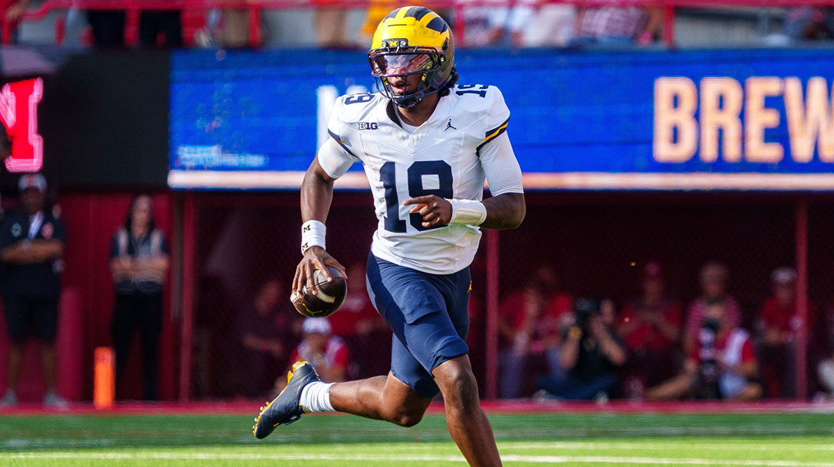 Michigan Wolverines quarterback Bryce Underwood (19) scrambles against the Nebraska Cornhuskers during the third quarter at Memorial Stadium.