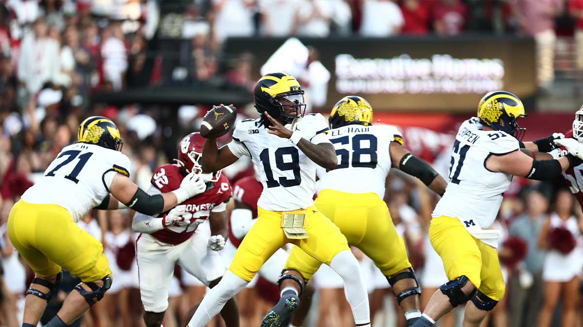 Michigan Wolverines quarterback Bryce Underwood (19) looks to pass downfield against the Oklahoma Sooners during the first half at Gaylord Family-Oklahoma Memorial Stadium.
