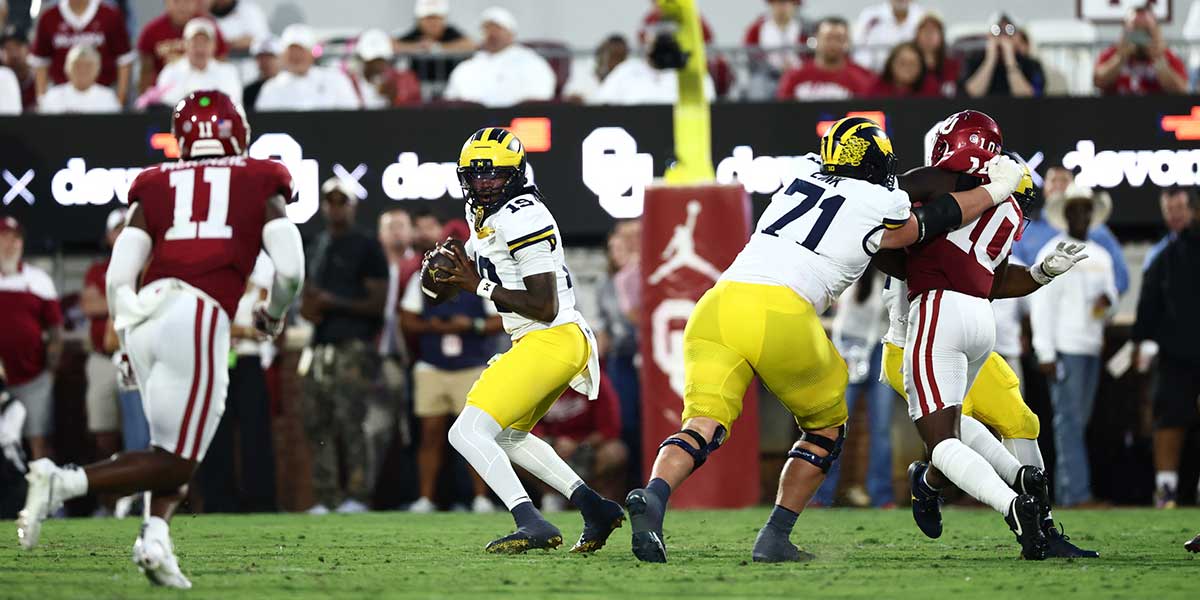Michigan Wolverines quarterback Bryce Underwood (19) stands in the pocket against the Oklahoma Sooners during the first half at Gaylord Family-Oklahoma Memorial Stadium.