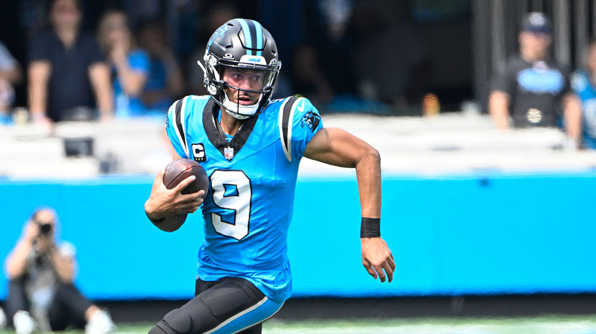 Carolina Panthers quarterback Bryce Young (9) runs in the first quarter at Bank of America Stadium.