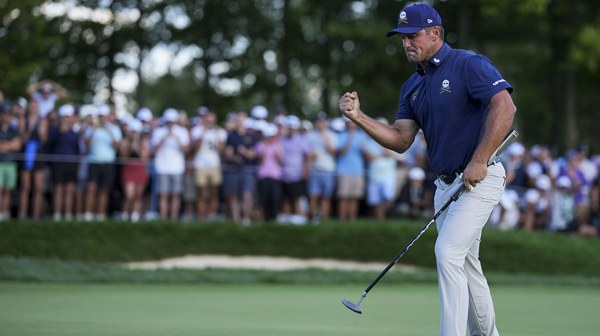 Bryson DeChambeau of Crushers GC reacts to making his putt on the 18th green in a playoff hole during the finals of the LIV Golf Michigan Team Championship at The Cardinal at Saint John's Resort.