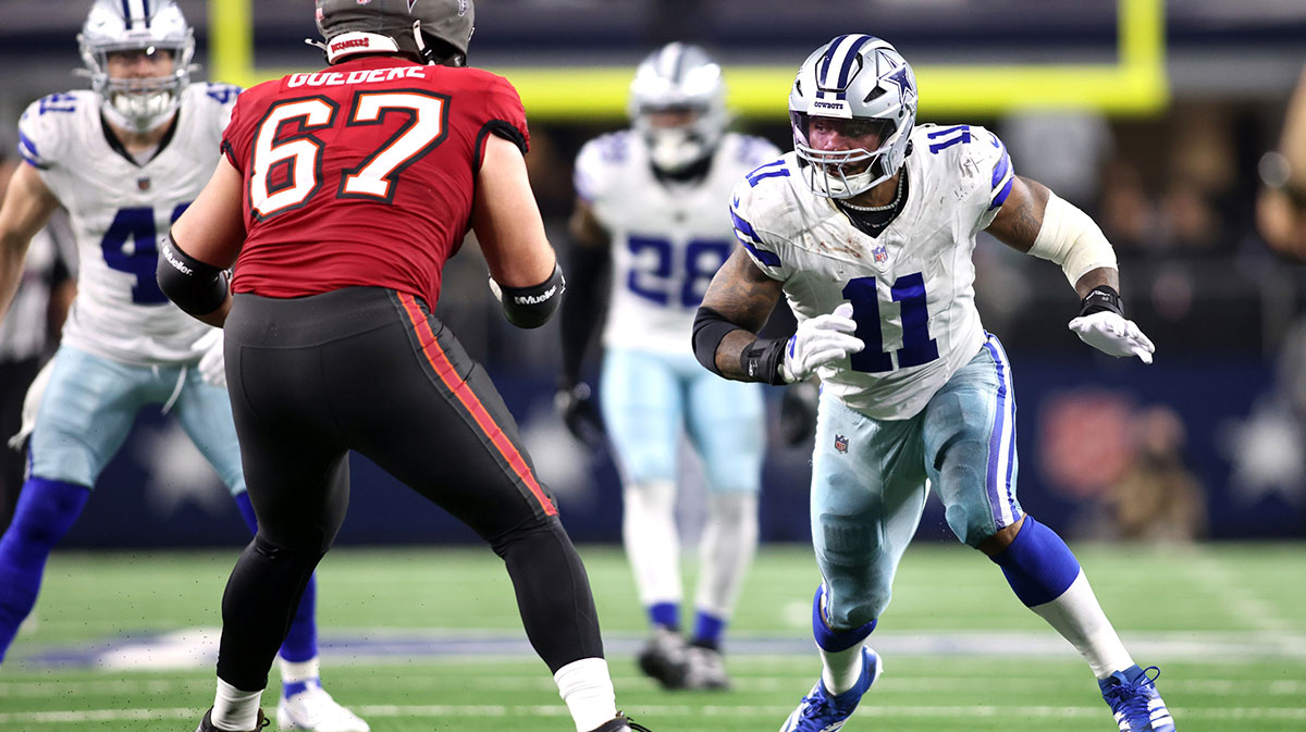 Dallas Cowboys linebacker Micah Parsons (11) rushes the passer against Tampa Bay Buccaneers offensive tackle Luke Goedeke (67) in the fourth quarter at AT&T Stadium.