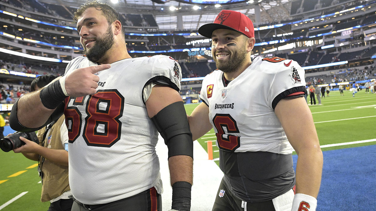 Tampa Bay Buccaneers guard Ben Bredeson (68) and quarterback Baker Mayfield (6) celebrate as the leave the field after defeating the Los Angeles Chargers at SoFi Stadium.