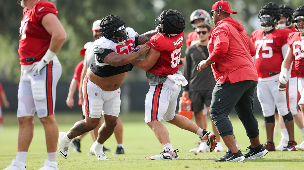 Tampa Bay Buccaneers defensive tackle Vita Vea (50) and center Graham Barton (62) participate in training camp at AdventHealth Training Center.