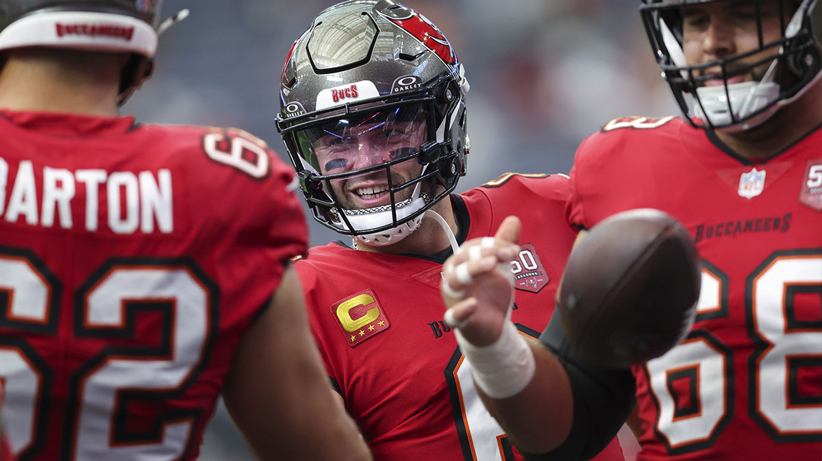 Tampa Bay Buccaneers quarterback Baker Mayfield (6) talks with teammates on the field before the game against the Houston Texans at NRG Stadium.