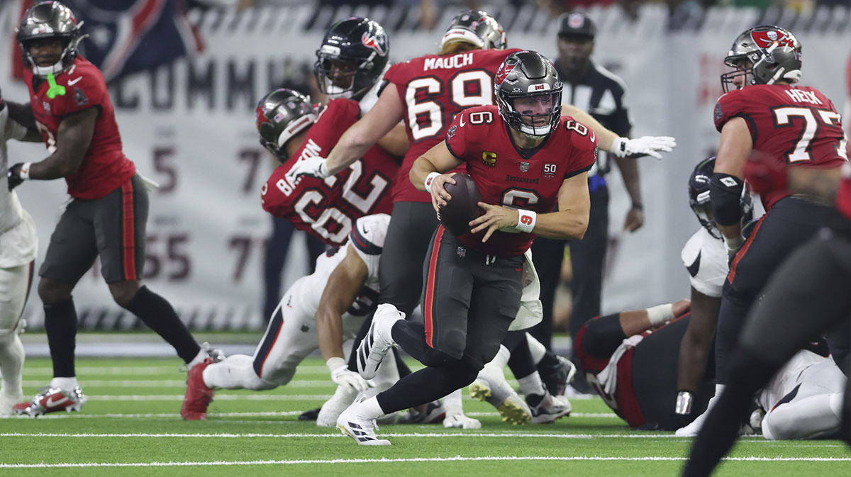 Tampa Bay Buccaneers quarterback Baker Mayfield (6) runs with the ball during the fourth quarter against the Houston Texans at NRG Stadium.