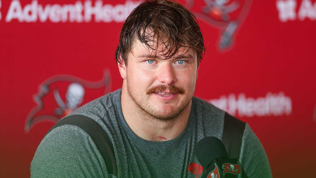 Tampa Bay Buccaneers offensive tackle Luke Goedeke (67) talks to media after training camp at AdventHealth Training Center.