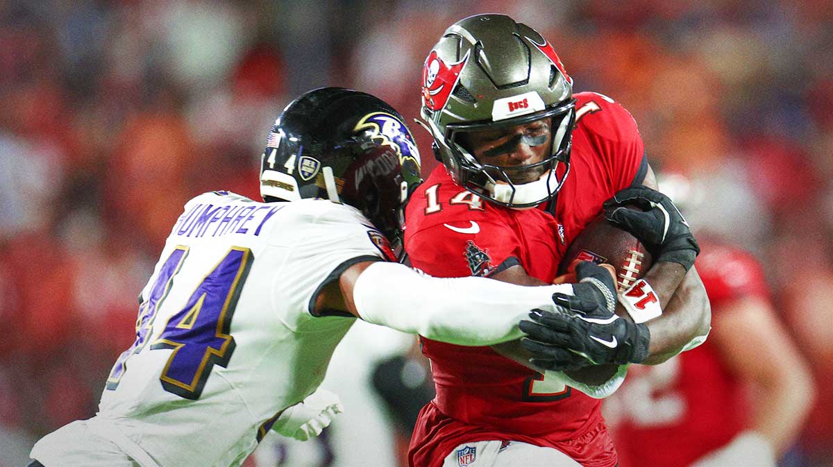 Tampa Bay Buccaneers wide receiver Chris Godwin (14) is pressured by Baltimore Ravens cornerback Marlon Humphrey (44) in the second quarter at Raymond James Stadium.