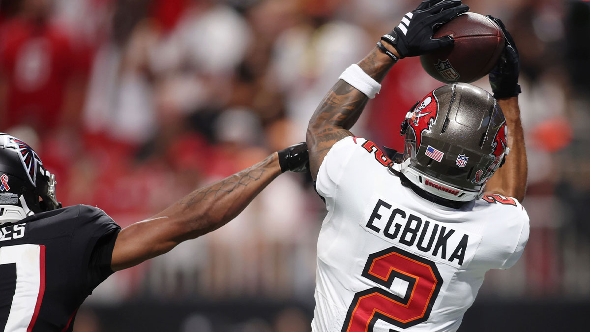 Tampa Bay Buccaneers wide receiver Emeka Egbuka (2) makes a catch against Atlanta Falcons cornerback Mike Hughes (21) for a touchdown during the fourth quarter at Mercedes-Benz Stadium.