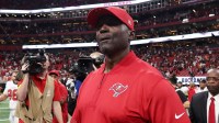 Tampa Bay Buccaneers head coach Todd Bowles walks on the field after their win against the Atlanta Falcons at Mercedes-Benz Stadium.