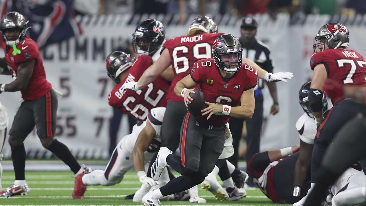 Tampa Bay Buccaneers quarterback Baker Mayfield (6) runs with the ball during the fourth quarter against the Houston Texans at NRG Stadium.