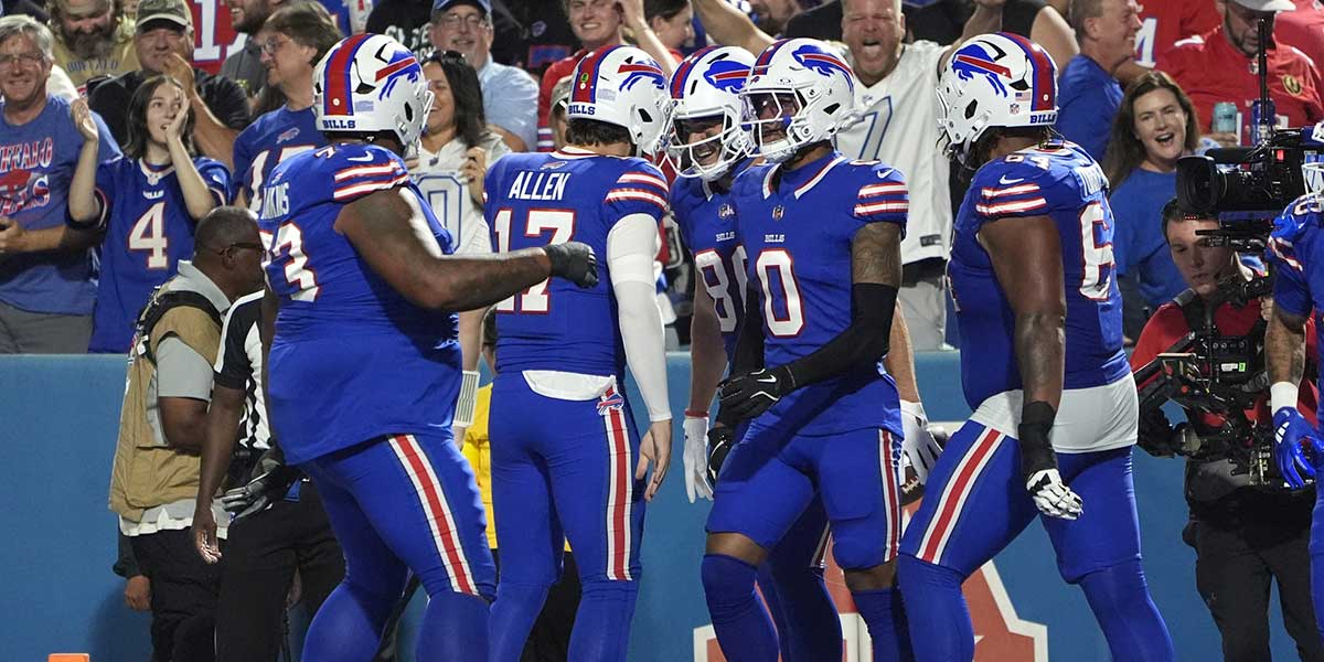 Buffalo Bills tight end Dalton Kincaid (86) celebrates with quarterback Josh Allen (17) after scoring a touchdown against the Miami Dolphins in the first quarter at Highmark Stadium.