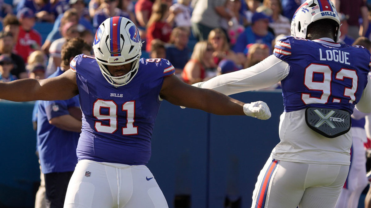 Buffalo Bills defensive tackle Ed Oliver and defensive tackle Zion Logue dance to the music for a few moments while waiting for their turn to run a drill during the Return of the Blue & Red practice at Highmark Stadium in Orchard Park on Aug.1, 2025.