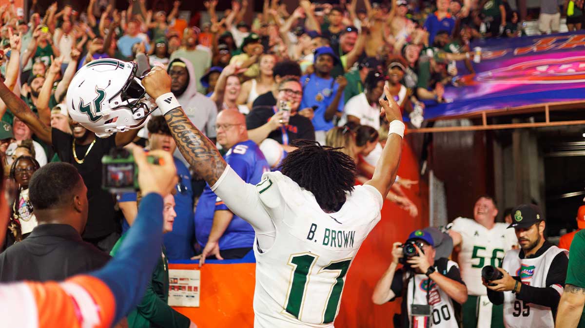 South Florida Bulls quarterback Byrum Brown (17) gestures towards fans after a game against the Florida Gators at Ben Hill Griffin Stadium.