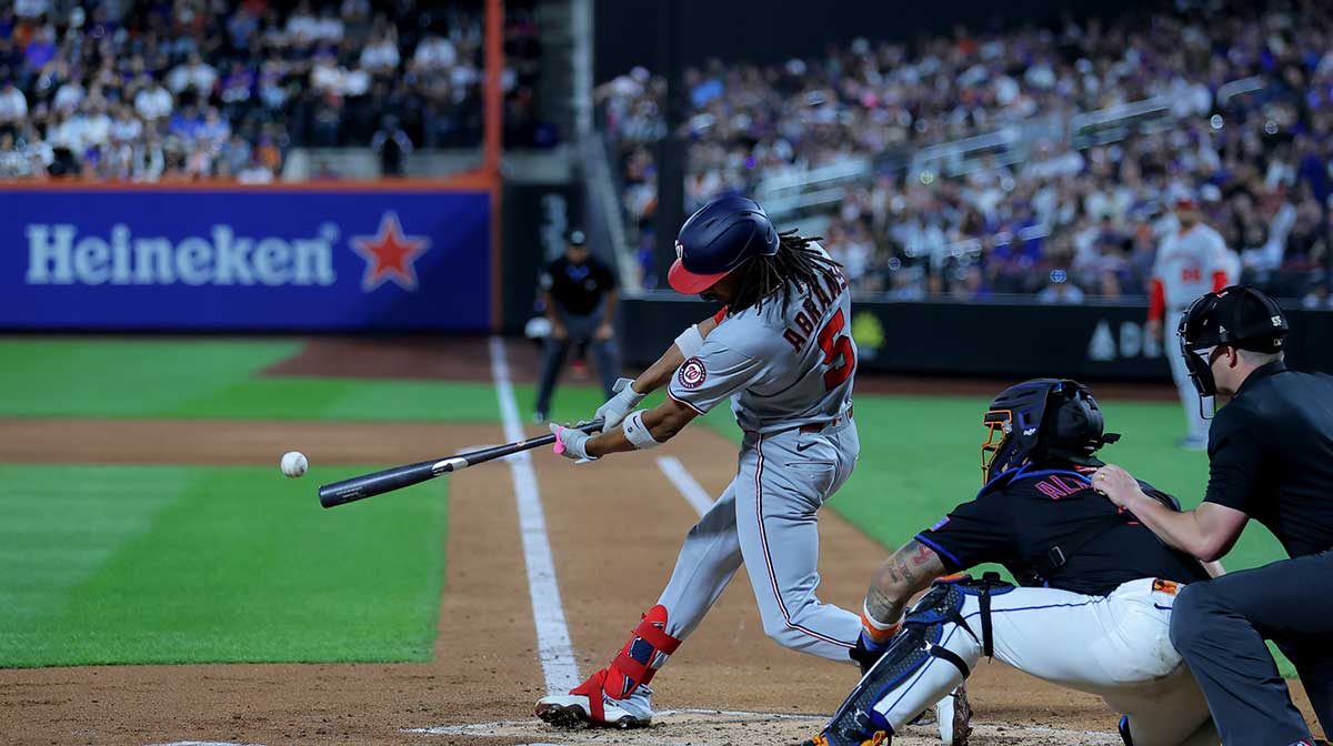 Washington Nationals shortstop CJ Abrams (5) hits an RBI double against the New York Mets during the third inning at Citi Field.