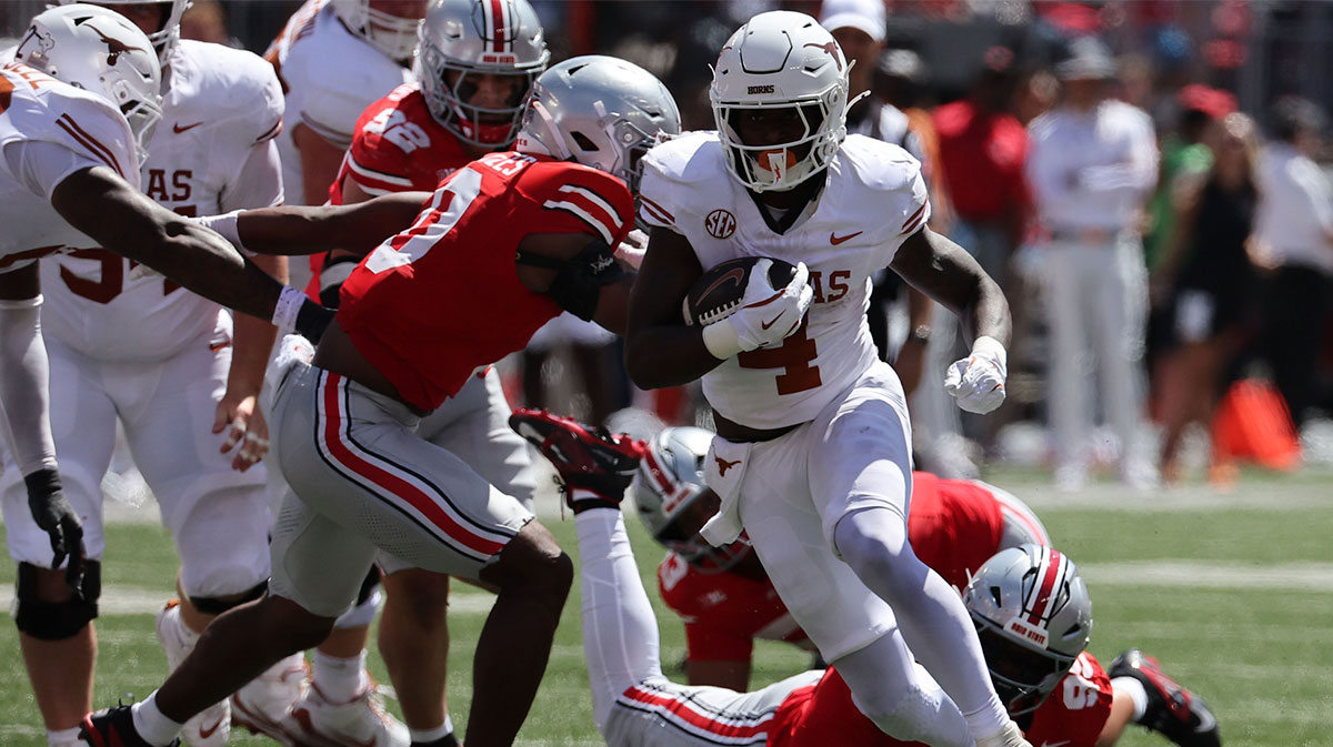 Texas Longhorns running back CJ Baxter (4) rushes the ball against the Ohio State Buckeyes in the first half at Ohio Stadium.