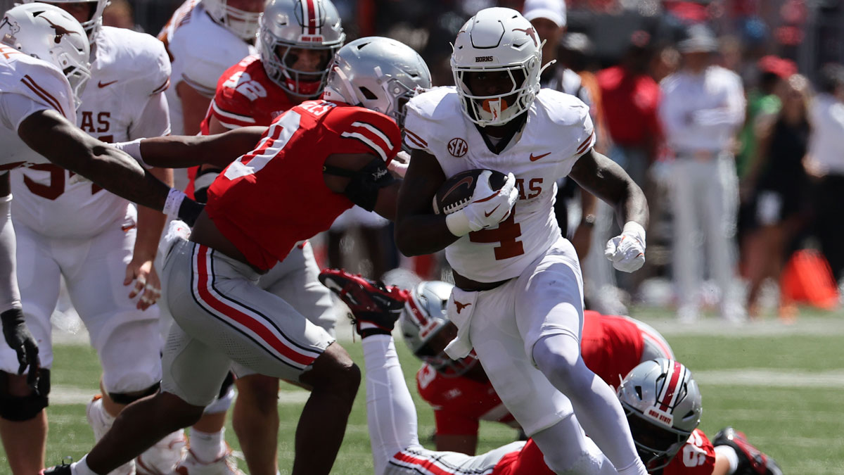 Texas Longhorns running back CJ Baxter (4) rushes the ball against the Ohio State Buckeyes in the first half at Ohio Stadium.