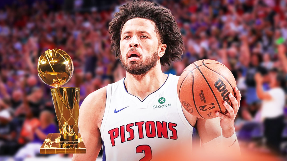 Cade Cunningham with NBA championship trophy on basketball crowd